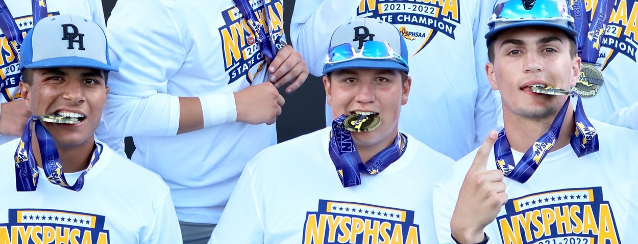 Baseball players biting state championship medals (6/2022)