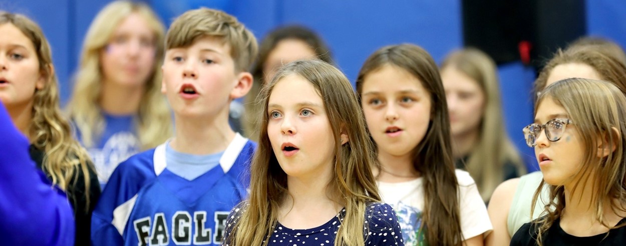 Middle School students singing.